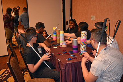 Youth Track participants enjoy a crafts activity involving duct tape.
